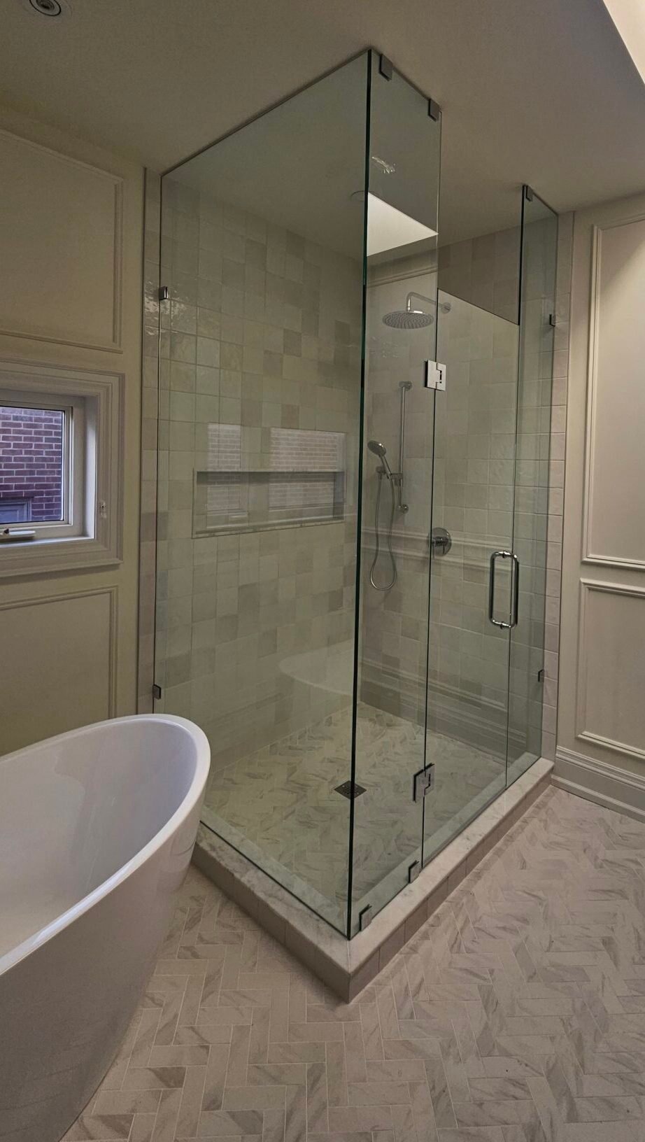 Modern bathroom with a custom corner glass shower, done in Toronto